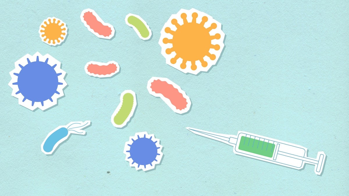 injection or vaccination pointing towards graphics of viruses and particles