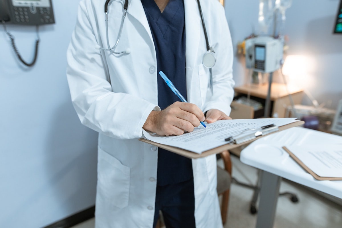 doctor taking patient notes