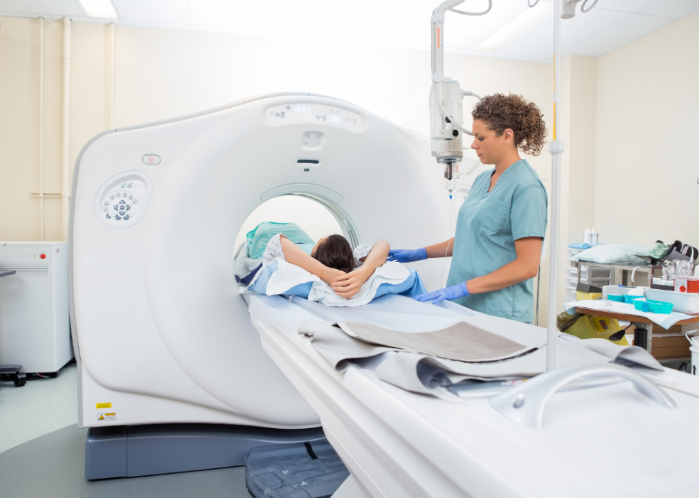 Nurse preparing patient for CT scan.